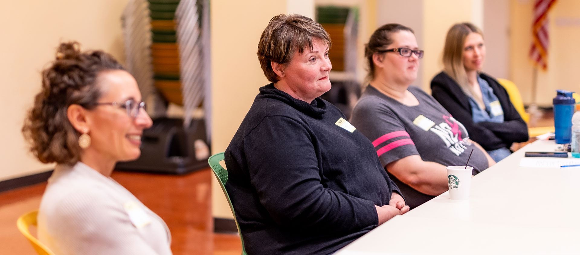 Caregivers listen at a Parent Connect meeting