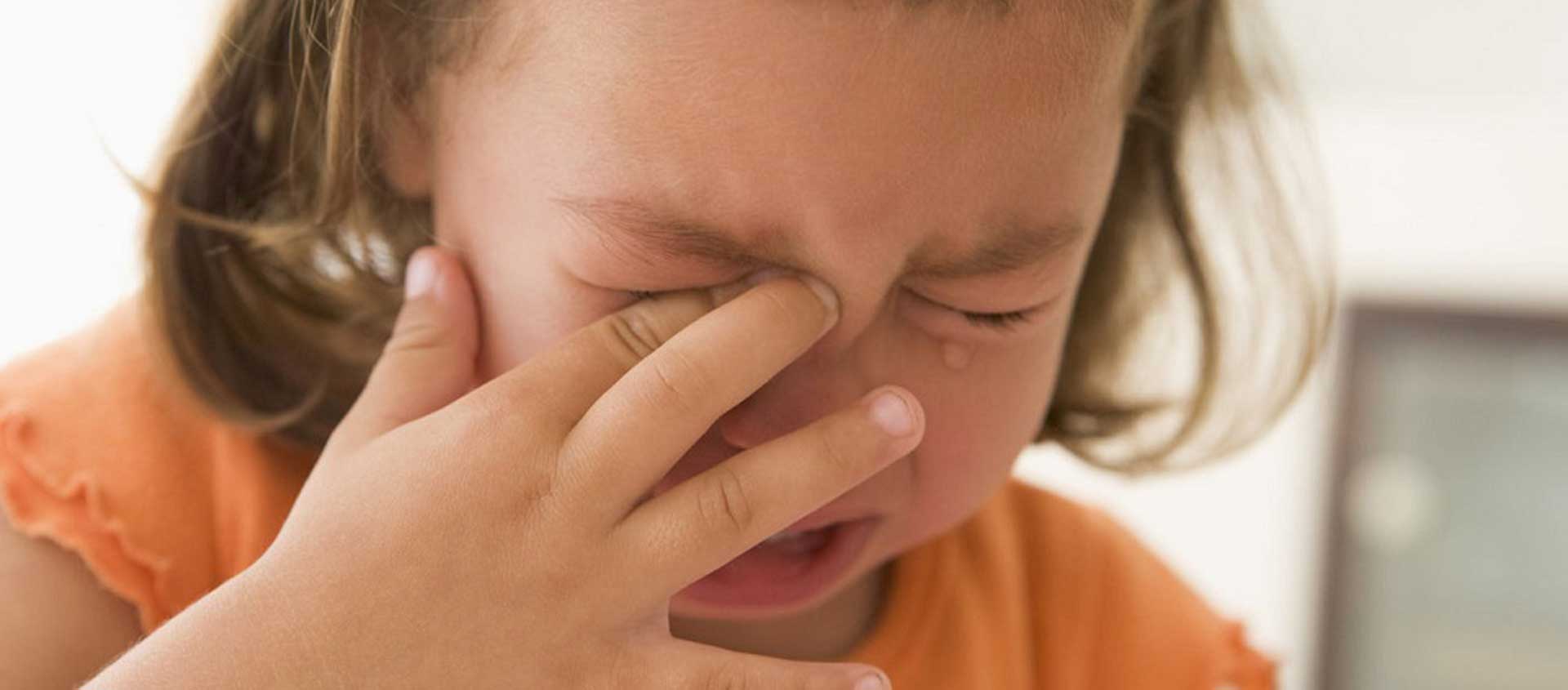 A preschool-age girl crying